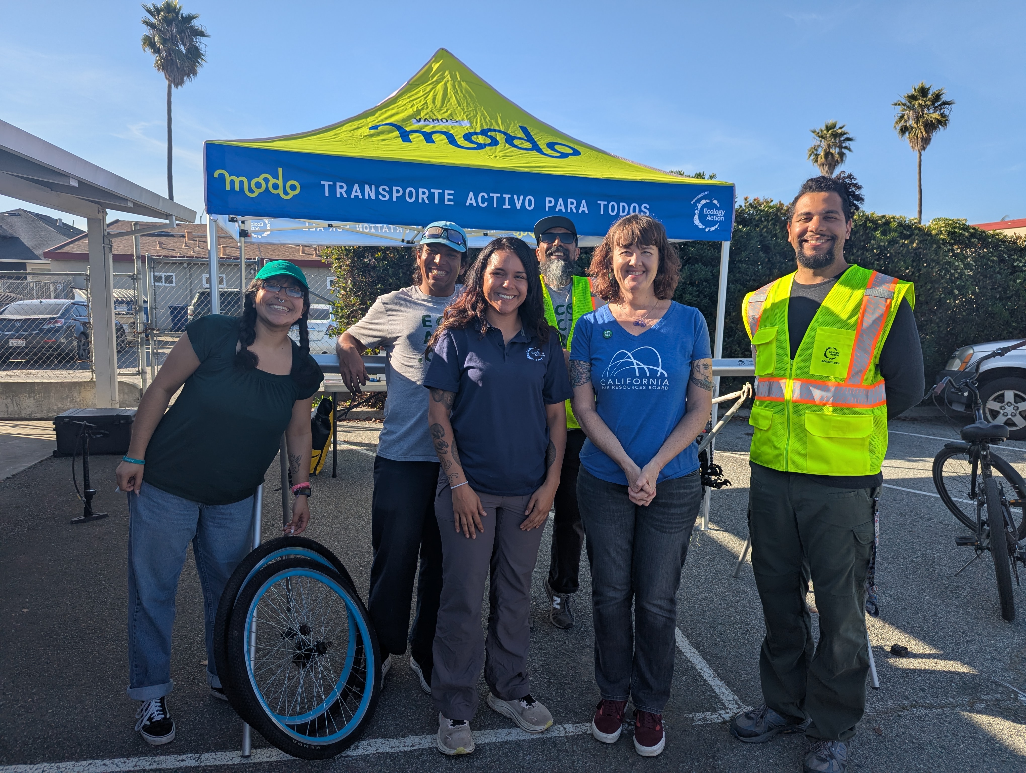 ¡Adelante Watsonville! team at bike repair booth